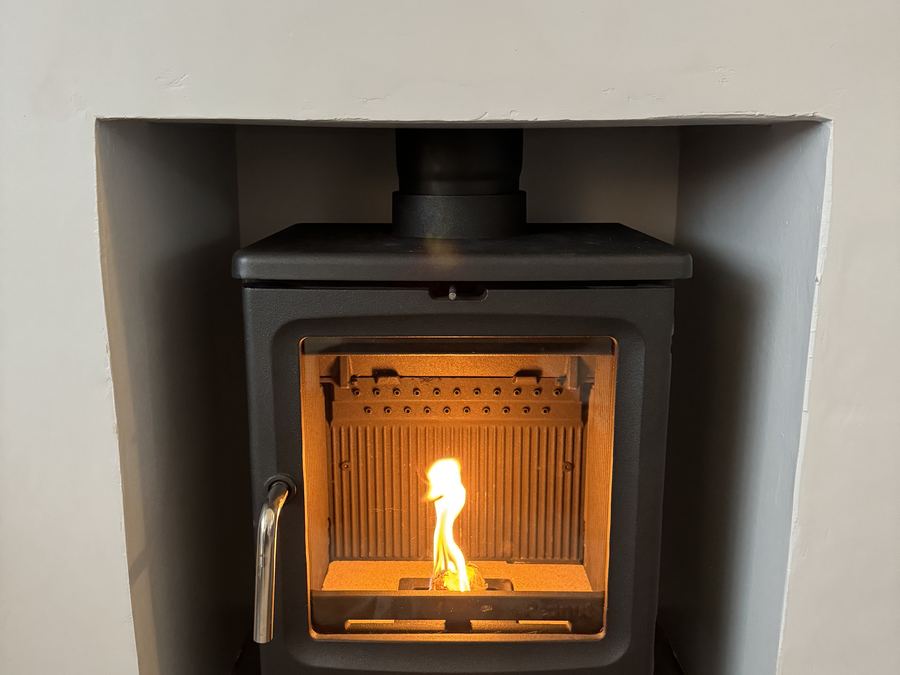 The first fire burning in a newly installed woodburning stove
